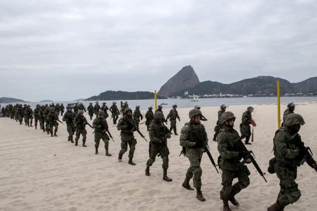 Brazilian marines disembark on Flamengo Beach, near the site that will host the sailing competitions of the Rio 2016 Olympic Games, during a drill  in Rio de Janeiro. Picture: AFP PHOTO / CHRISTOPHE SIMON/AFP/Getty Images