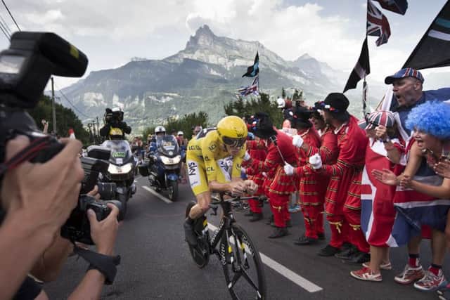 Fans cheer as Britain's Chris Froome passes during stage 18 of the Tour de France. Picture: AP Photo/Peter Dejong