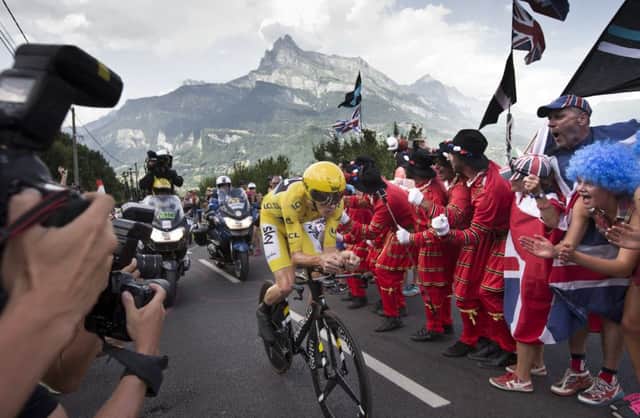 Fans cheer as Britain's Chris Froome passes during stage 18 of the Tour de France. Picture: AP Photo/Peter Dejong