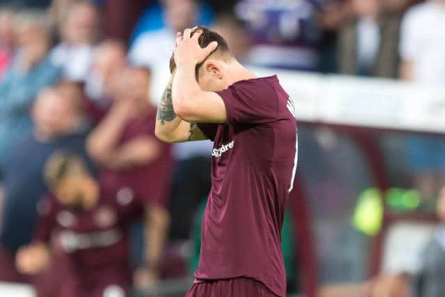 Sam Nicholson can't hide his disappointment at full time. Picture: PA