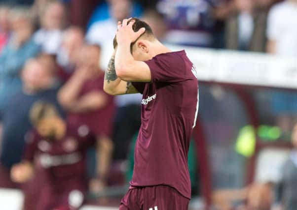 Sam Nicholson can't hide his disappointment at full time. Picture: PA