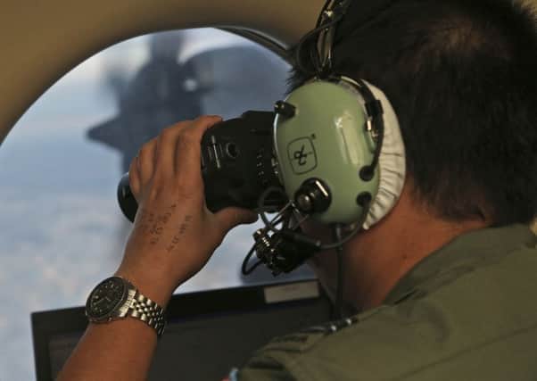 Hunt for Flight 370 is to be suspended. AP Photo/Rob Griffith
