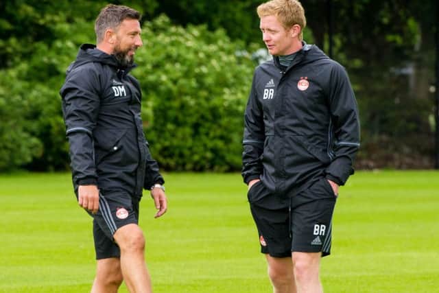 Barry Robson, right, has found his new coaching role under Derek McInnes testing. Picture: SNS