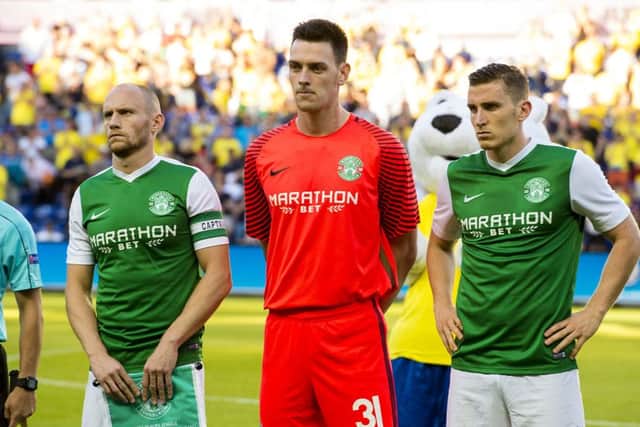 Ross Laidlaw, centre, was part of sterling defensive effort by Hibs. Picture: SNS