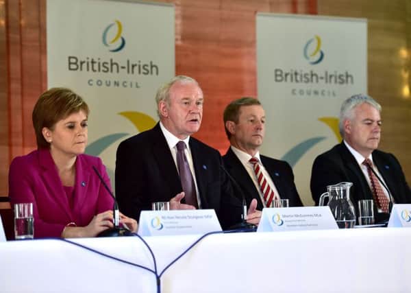 Nicola Sturgeon, Enda Kenny and Carwyn Jones listen as Martin McGuinness speaks during the British Irish Council press conference. Picture: PA