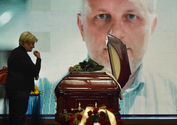 People pay tribute to Belarus-born journalist Pavel Sheremet, who was killed in a car bomb in central Kiev. Picture: AFP/Getty