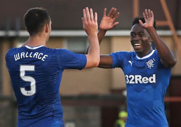 Dodoo, right, celebrates with Lee Wallace after netting his first goal for the club. Picture: PA