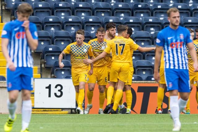 Mortons Gary Oliver (No.7) is congratulated by his team-mates after netting the opener. Pic: SNS