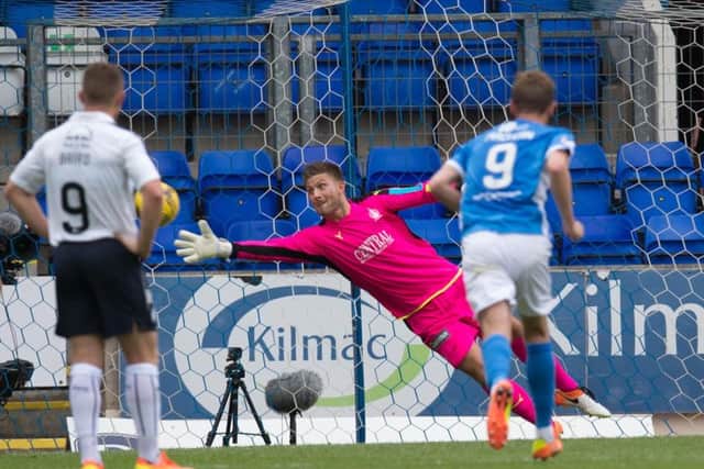 Falkirk keeper Danny Rogers cant reach Danny Swansons 38th-minute penalty  the third one he faced. Pic: Universal