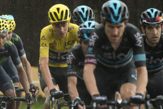 Job nearly done for Chris Froome as his trusted team-mates, led by Geraint Thomas, surround him during the penultimate stage. Picture: Peter Dejong/AP