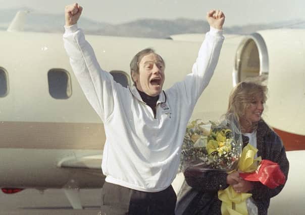 Thomas Sutherland celebrates his release after being abducted and held for more than six years by militants in Lebanon. Picture: AP