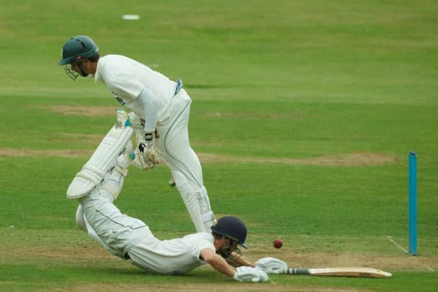 Forfarshire captain Craig Wallace dives for the crease on his way to scoring 46, as the ball evades Carlton wicketkeeper Rory McCann. Picture: Toby Williams
