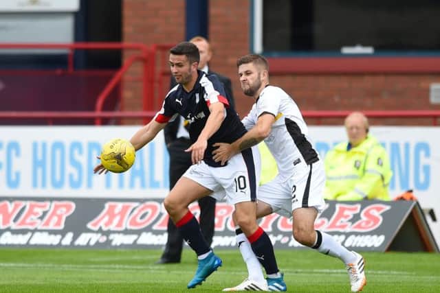 Dundees Michael Duffy, left,  holds off the challenge of Dumbartons Craig Pettigrew. Picture: SNS Group