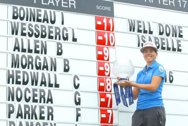 Isabelle Boineau holds the trophy after claiming victory in the Scottish Ladies' Open at Dundonald Links. Picture: Paul Severn