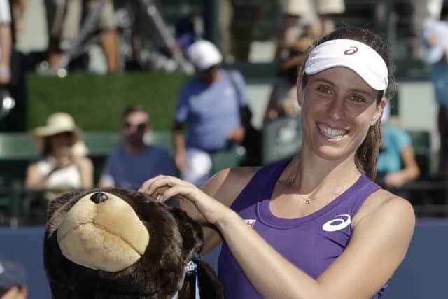 Johanna Konta holds a stuffed bear, the symbol of California, after her victory at Stanford. Picture: AP