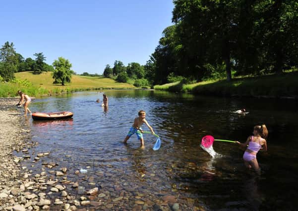 Young people enjoy fun in the River Teith at Doune. Picture Robert Perry