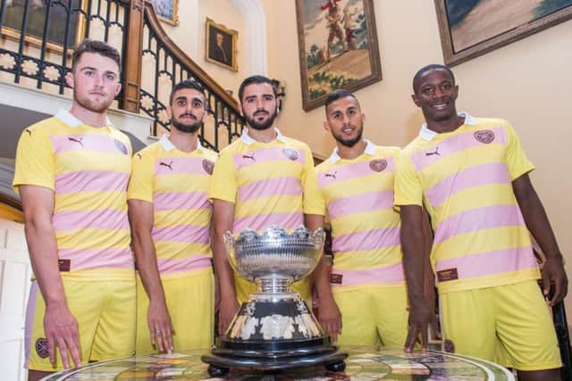 Wearing the clubs new  change strip, Alim Ozturk,  centre, with the Rosebury Cup, is flanked by  team-mates, from left,  John Souttar, Igor Rossi, Faycal Rherras, and Arnauld Djoum at Dalmeny House, South Queensferry. Picture: Ian Georgeson