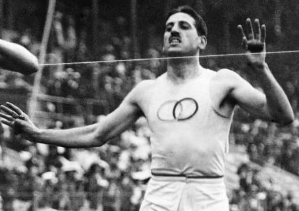 French athlete Jean Bouinin was pipped at the post in the 5000m final at the Stockholm Olympic Games in 1912. Picture: AFP/Getty Images
