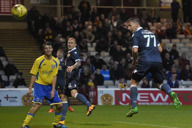 Scott McDonald heads home to give Motherwell a 2-0 lead over East Stirlinghsire. Picture: SNS