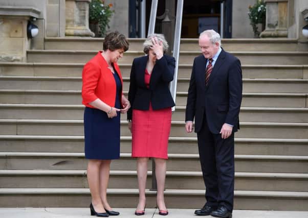 Prime Minister Theresa May meets Northern Ireland First Minister Arlene Foster, left, and her deputy Martin McGuinness at Stormont. Picture: Charles McQuillan/Getty
