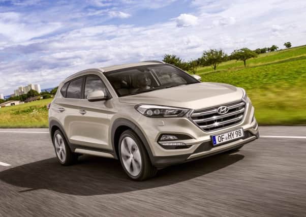 The Tuscon has a flashy grille, but its performance is as unexciting as its smart interior