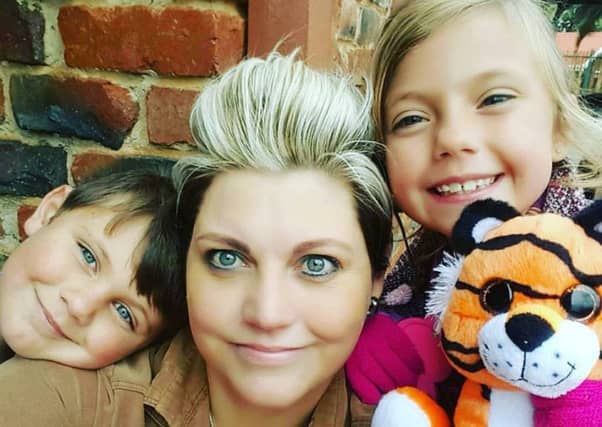 Riekie - who desperately needs a bone marrow transplant - with her two young children. Picture: Contributed