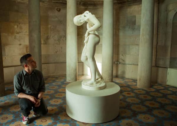 Artist Jonathan Owen with his re-carved 19th century sculpture. Picture: Toby Williams