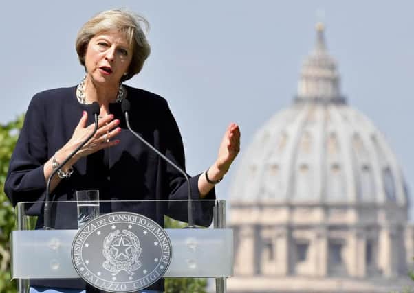 Theresa May speaks after meeting with Italian prime minister Matteo Renzi in Rome. Picture: AP