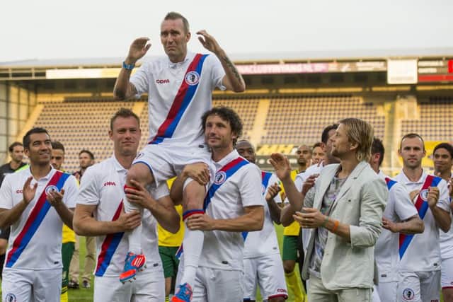 Fernando Ricksen is carried from the pitch on the shoulders of his fellow players following a charity football match in his childhood town of Sittard in 2014. Picture: Getty