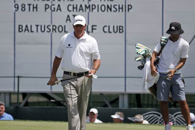 Phil Mickelson prepares to putt on the 18th green during a practice round at Baltusrol, New Jersey. Picture: AP