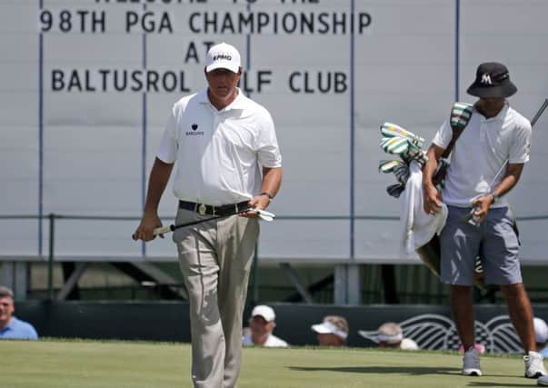Phil Mickelson prepares to putt on the 18th green during a practice round at Baltusrol, New Jersey. Picture: AP