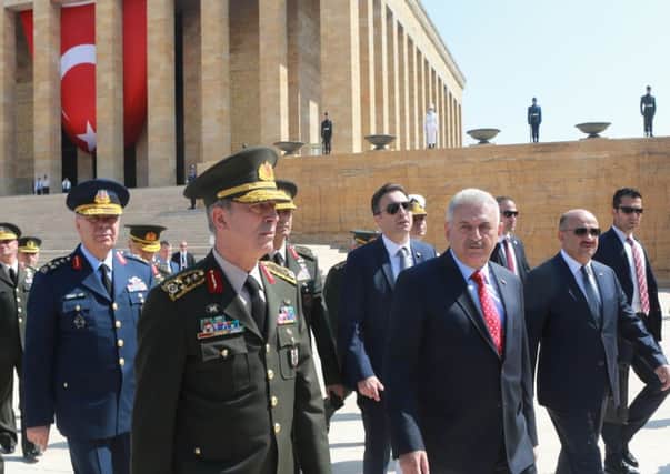 Turkeys PM Binali Yildirim, second left, as the Supreme Military Council visited Ankara yesterday. Picture: AFP/Getty Images