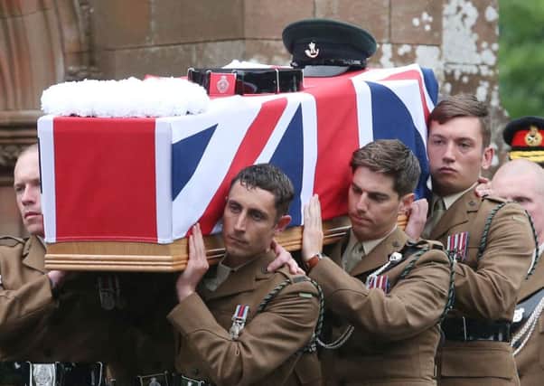 The coffin of Corporal Josh Hoole is carried into Crichton Memorial church in Dumfries. Picture: PA