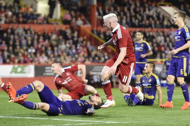 Jonny Hayes caps a thrilling first leg against Europa League opponents Maribor by scoring a late equaliser for Aberdeen. Picture: Ian Rutherford/PA Wire.