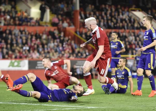 Jonny Hayes caps a thrilling first leg against Europa League opponents Maribor by scoring  a late equaliser for Aberdeen. Picture: Ian Rutherford/PA Wire.