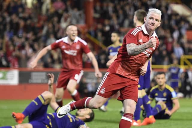Aberdeen's Jonny Hayes celebrates after scoring his side's late equaliser against Maribor. Picture: Ian Rutherford/PA.