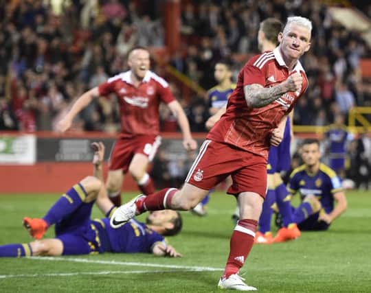 Aberdeen's Jonny Hayes celebrates after scoring his side's late equaliser against Maribor. Picture: Ian Rutherford/PA.