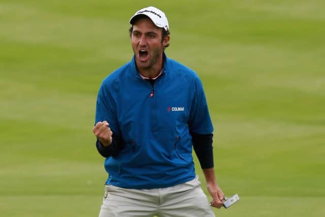 Edoardo Molinari celebrates after sinking a putt for a birdie. Picture: Andrew Redington/Getty Images