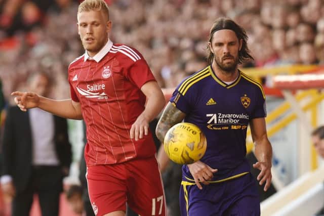 Jayden Stockley (left) and Adam Rooney were more than a handful for Maribor's Marko Suler. Picture: SNS