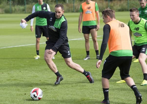 Celtic coach John Kennedy shows his skills as Celtic train ahead of their clash with Barcelona. Picture: SNS.