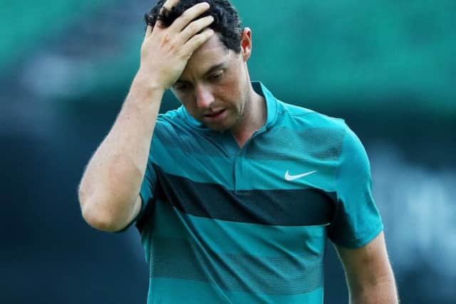 A frustrated Rory McIlroy walks off the 18th green at Baltusrol after sufferting an early exit in the US PGA. Picture: Getty