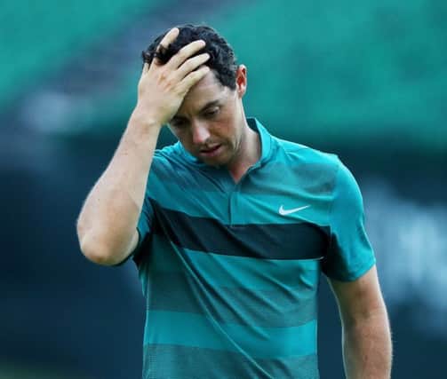 A frustrated Rory McIlroy walks off the 18th green at Baltusrol after sufferting an early exit in the US PGA. Picture: Getty