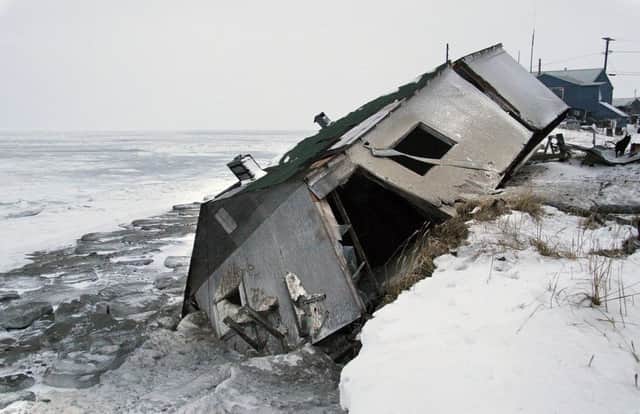 A house that slid on to the beach. Picture: AP
