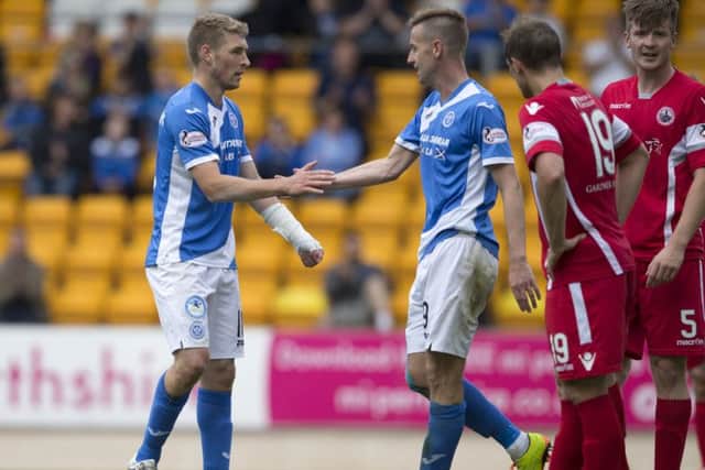 David Wotherspoon, left, celebrates his 90th-minute goal with team-mate Steven MacLean. Photograph: Graeme Hart