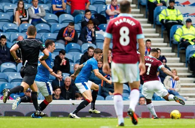 Andre Gray completes his hat-trick to put Burnley 3-0 ahead against at Ibrox. Photograph: Rangers FC/PA
