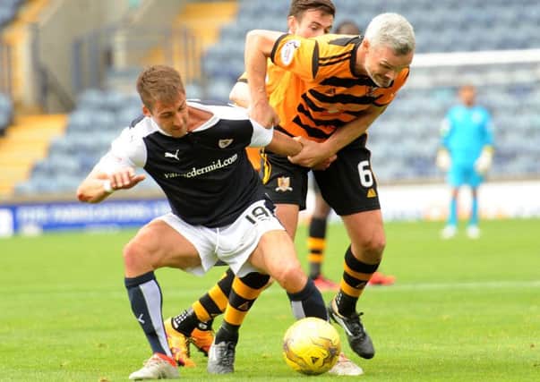 Rudi Skacel, left, gets involved in some arm wrestling with Jim Goodwin as Alloa topped the group. Photograph: Walter Neilson
