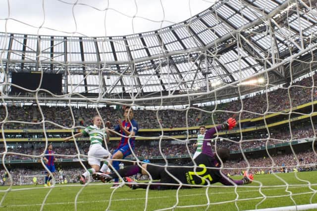 Leigh Griffiths capitalises on some slack defending by Jose Martinez to score Celtics equalising goal against Barcelona in Saturdays 3-1 defeat in Dublin. Picture: SNS Group