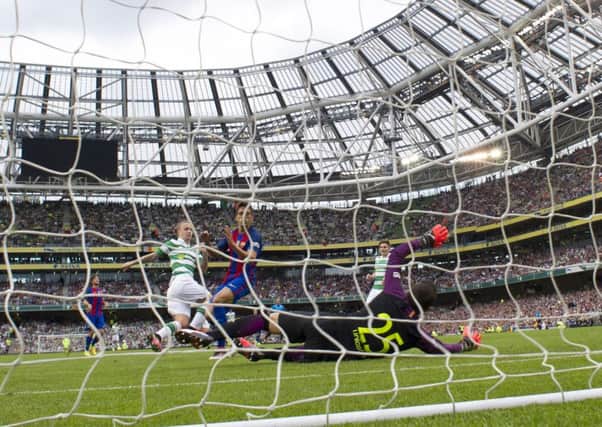 Leigh Griffiths capitalises on some slack defending by Jose Martinez to score Celtics equalising goal against Barcelona in Saturdays 3-1 defeat in Dublin. Picture: SNS Group