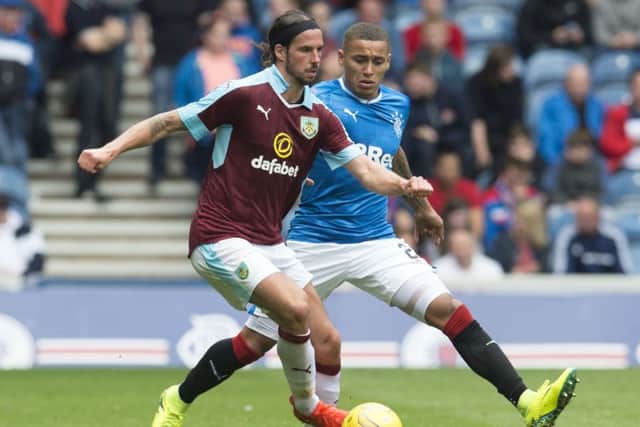 James Tavernier attempts to close down Burnleys George Boyd during the Lancashire clubs 3-1 victory over Rangers at Ibrox on Saturday. Picture: SNS Group