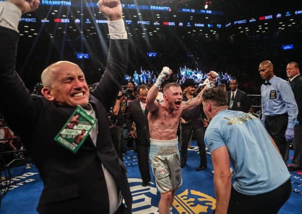 The delight on Barry McGuigans face is clear to see as Carl Frampton celebrates his WBA featherweight victory over Leo Santa Cruz at New Yorks Barclays Center. Picture: Getty Images